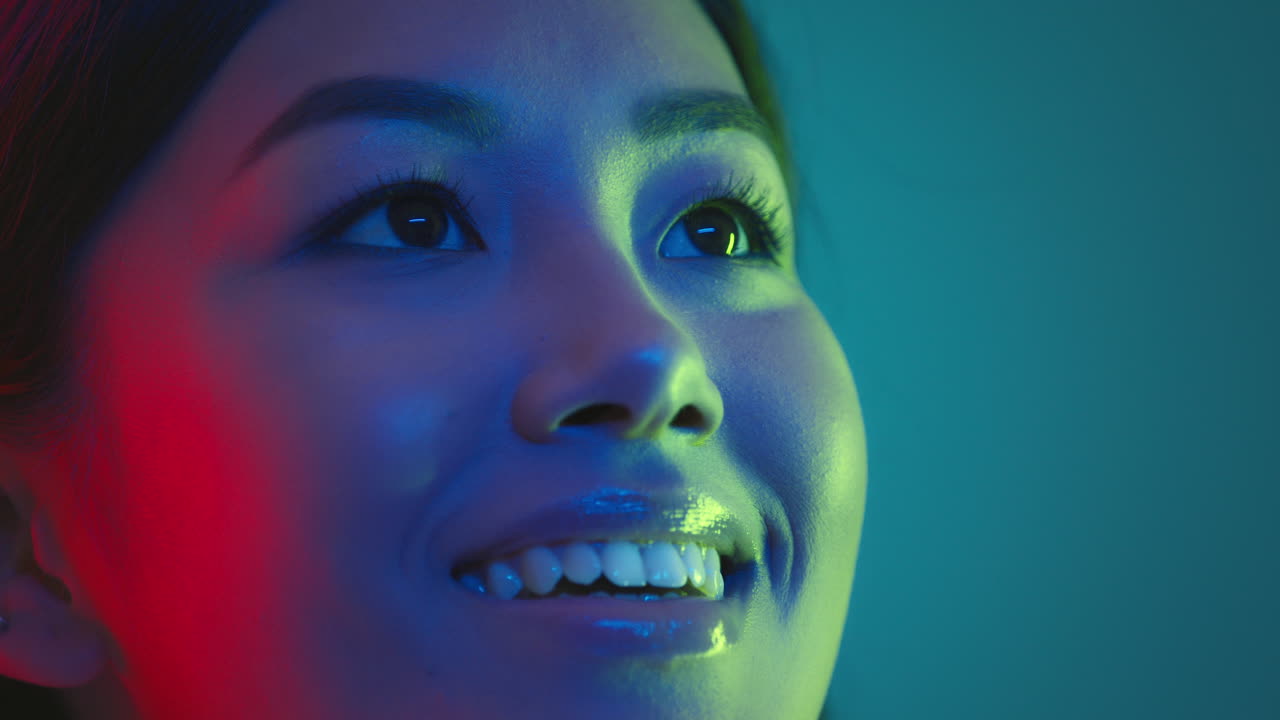 Close-up Portrait of a Woman with Vibrant Lighting