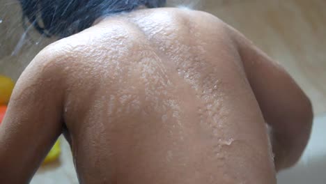 child taking a shower