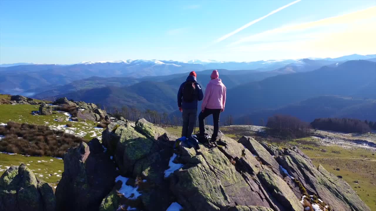 Hikers on a Mountain Peak