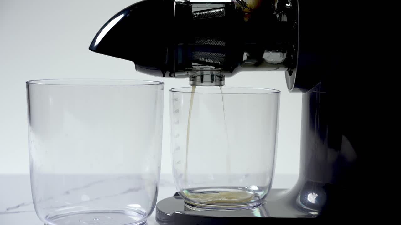 Juicer ready, glasses in place, fresh fruit nectar soon to grace