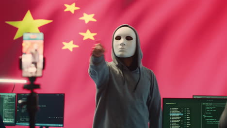 anonymous hacker expert in a chinese hacking high tech office