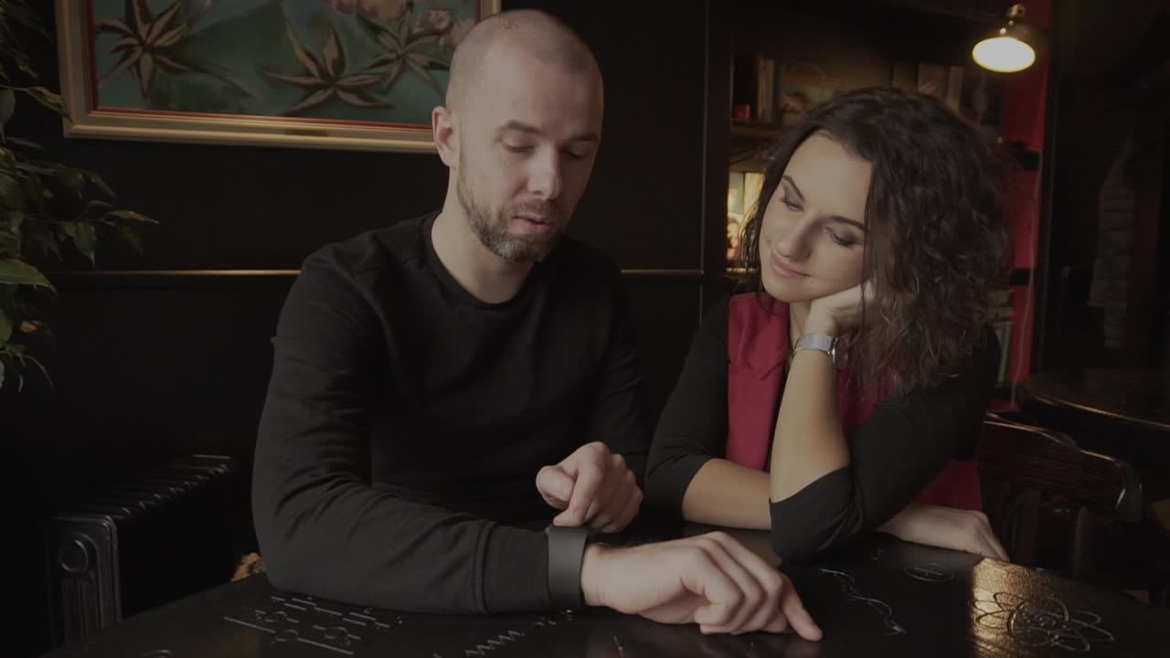 Couple in a cafe discussing