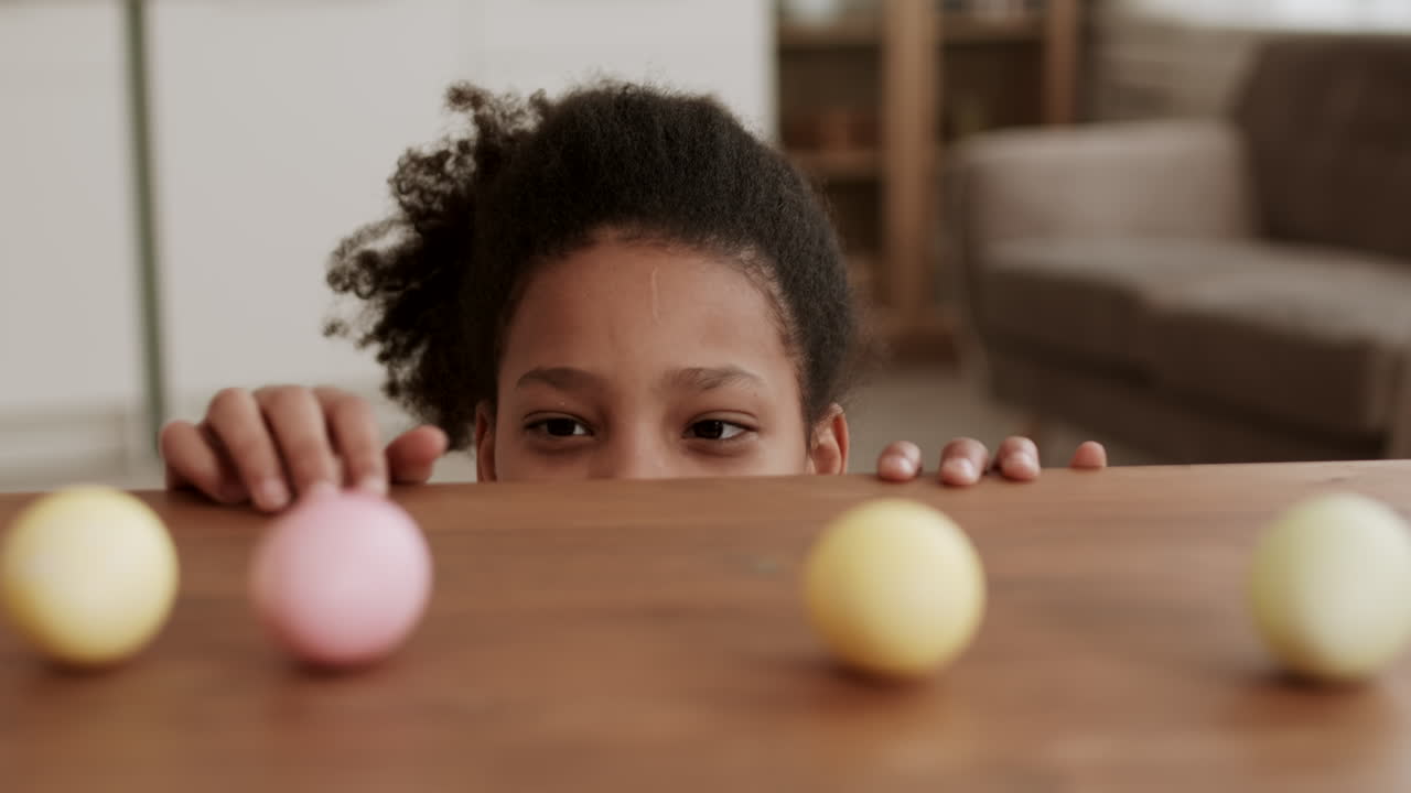 Playful Girl Taking Colored Egg