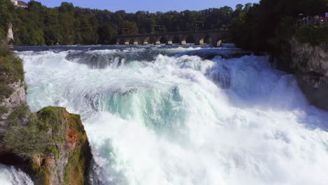 slow motion: panning shot of the roaring waterfall rheinfall at schaffhausen in switzerland