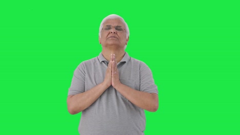 Religious-Indian-old-man-praying-to-God-Green-screen