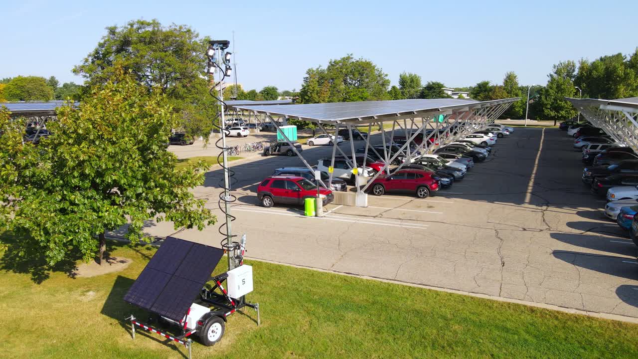 Solar energy powered parking lot and transportable lamp, aerial view