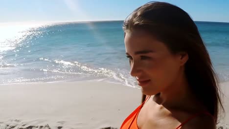 Beautiful-woman-smiling-on-the-beach