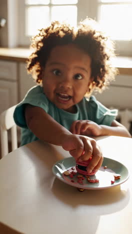 joyful child enjoying a macaron