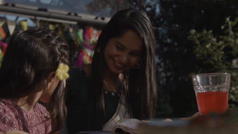 a woman and child at an outdoor celebration