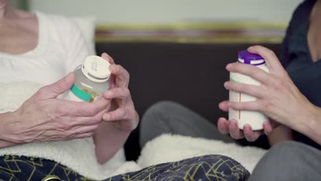 cropped shot of mature women choosing medicine.