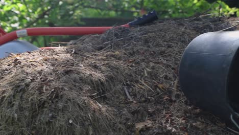 panning shot of a pile of manure ready to fertilize the soil