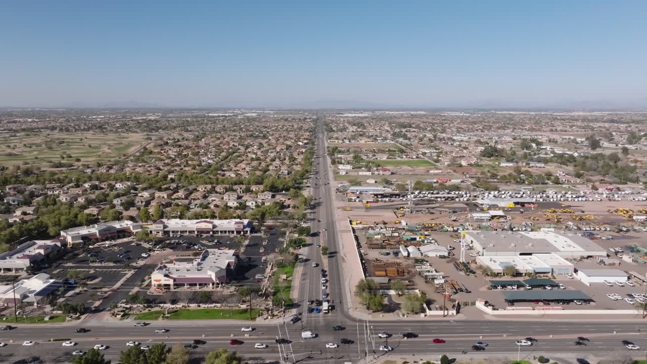 Aerial shot of busy traffic on junction during sunny day in Chandler, Arizona, USA. Sunny day with blue sky in american neighborgood. Wide shot.