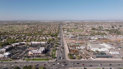 aerial shot of busy traffic on junction during sunny day in chandler, arizona, usa. sunny day with blue sky in american neighborgood. wide shot.