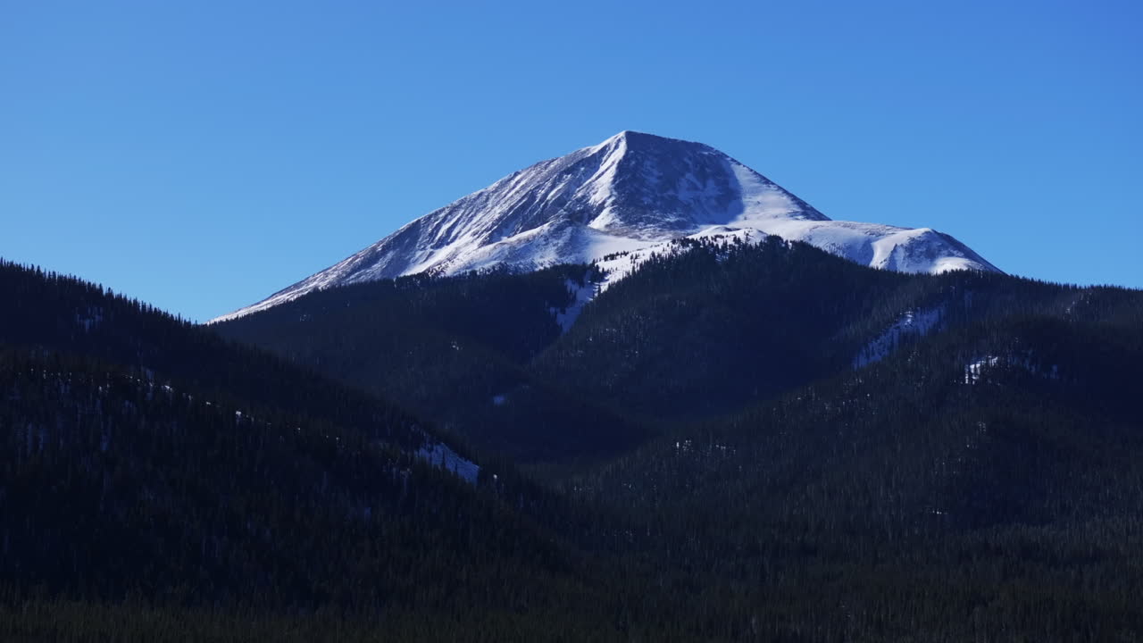 Breckenridge Colorado backcountry Boreas Mountain Pass aerial drone cinematic sunny blue clear sky North Fork Tiger Road Bald Rocky Mountain National Forest winter fresh snow circle right motion