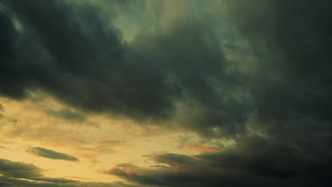 Dramatic-sunset-hues-as-clouds-sweep-overhead,-time-lapse