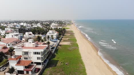 chennai city ecr beach waves in the residential area drone 4k shot