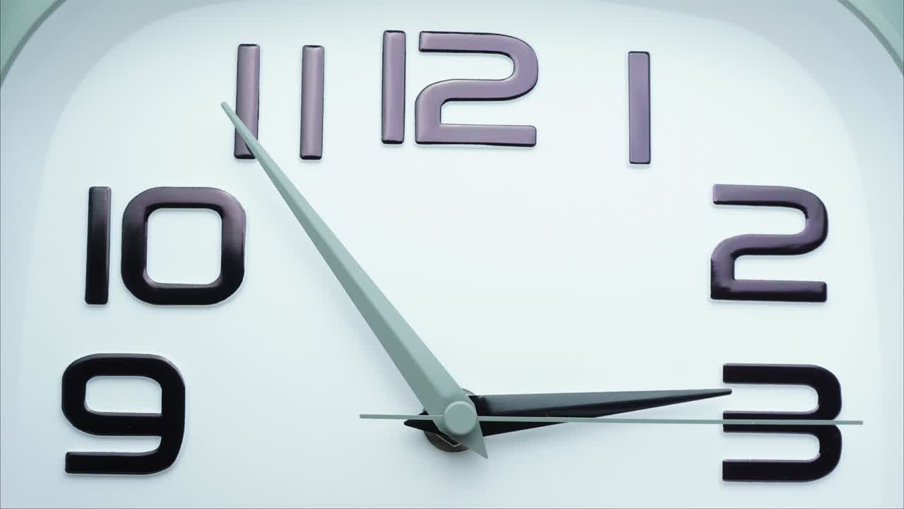 White wall clock tell time 3:15 p.m.