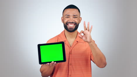 Tablet,-green-screen-and-man-okay