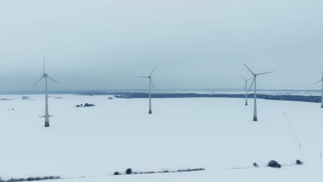 wind farm in winter, the blades rotate and generate electricity for consumers