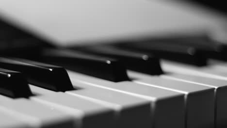 Close-up-macro-pan-of-black-and-white-piano-keys