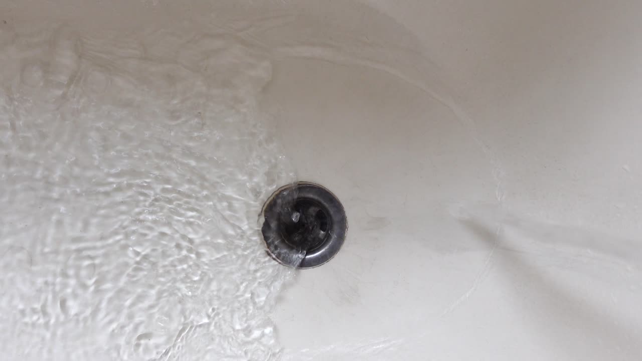 Water Draining into Bathtub Drain