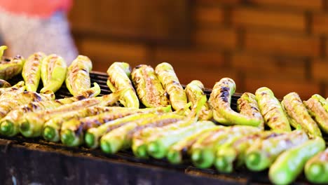 grilled food preparation at bangkok floating market