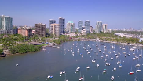 Aerial-follow-jet-ski-into-harbor-full-of-boats