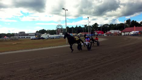 working out sulkies before a race at the cumberland fair near portland, maine