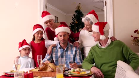 three generation family having christmas dinner together