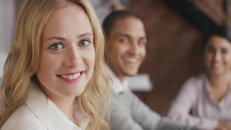 Portrait-of-a-confident-young-business-woman--at-boardroom-table-In-slow-motion-turning-around-and-smiling