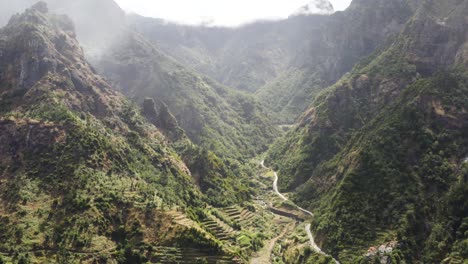 aerial is flying backwards showing beautiful landscape on serra de agua, madeira, portugal