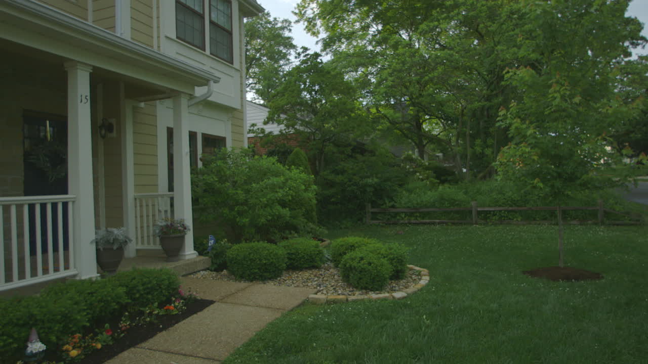 Front yard of house in the suburbs on a summer evening