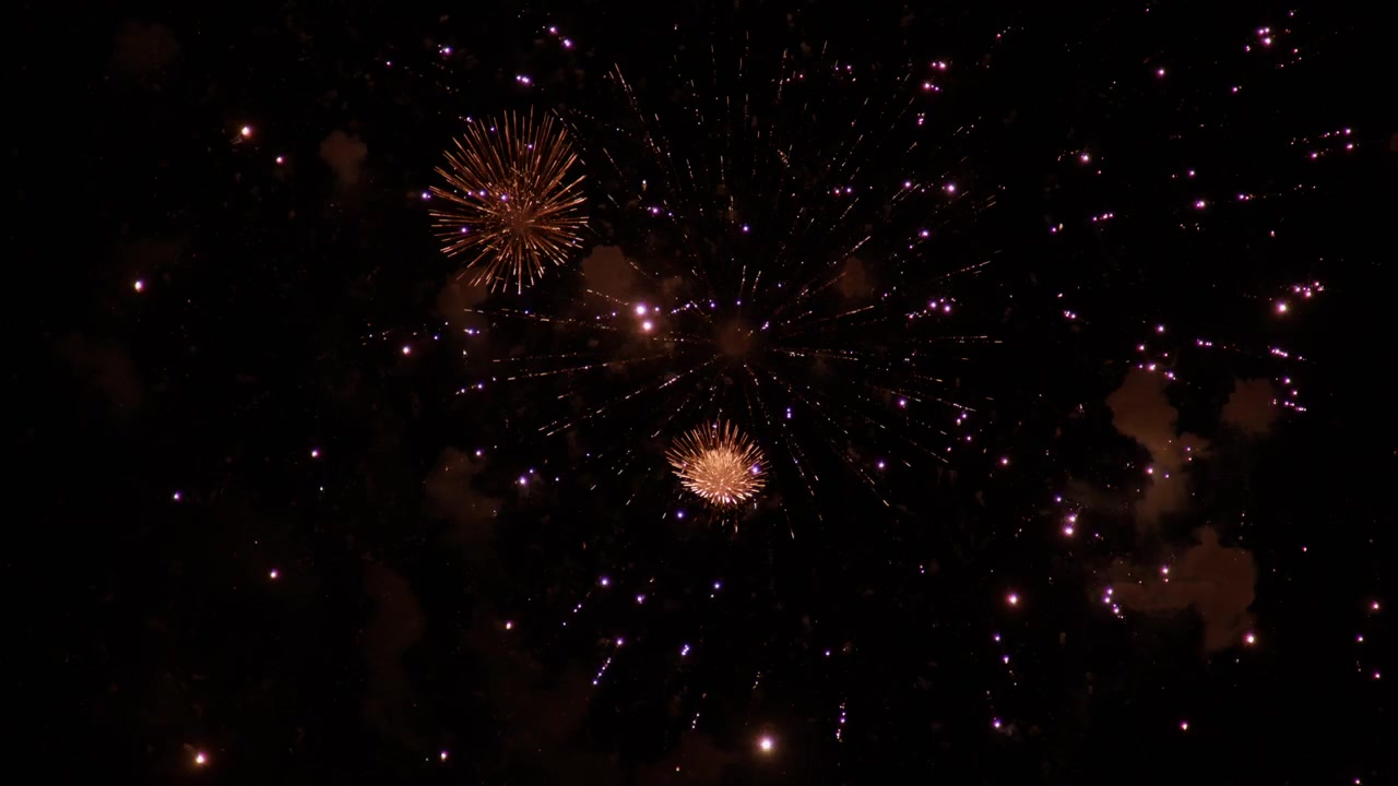 Sparkling Pyrotechnics In Red And Golden-yellow Colors During Adachi Fireworks Festival In Japan. Low Angle Shot