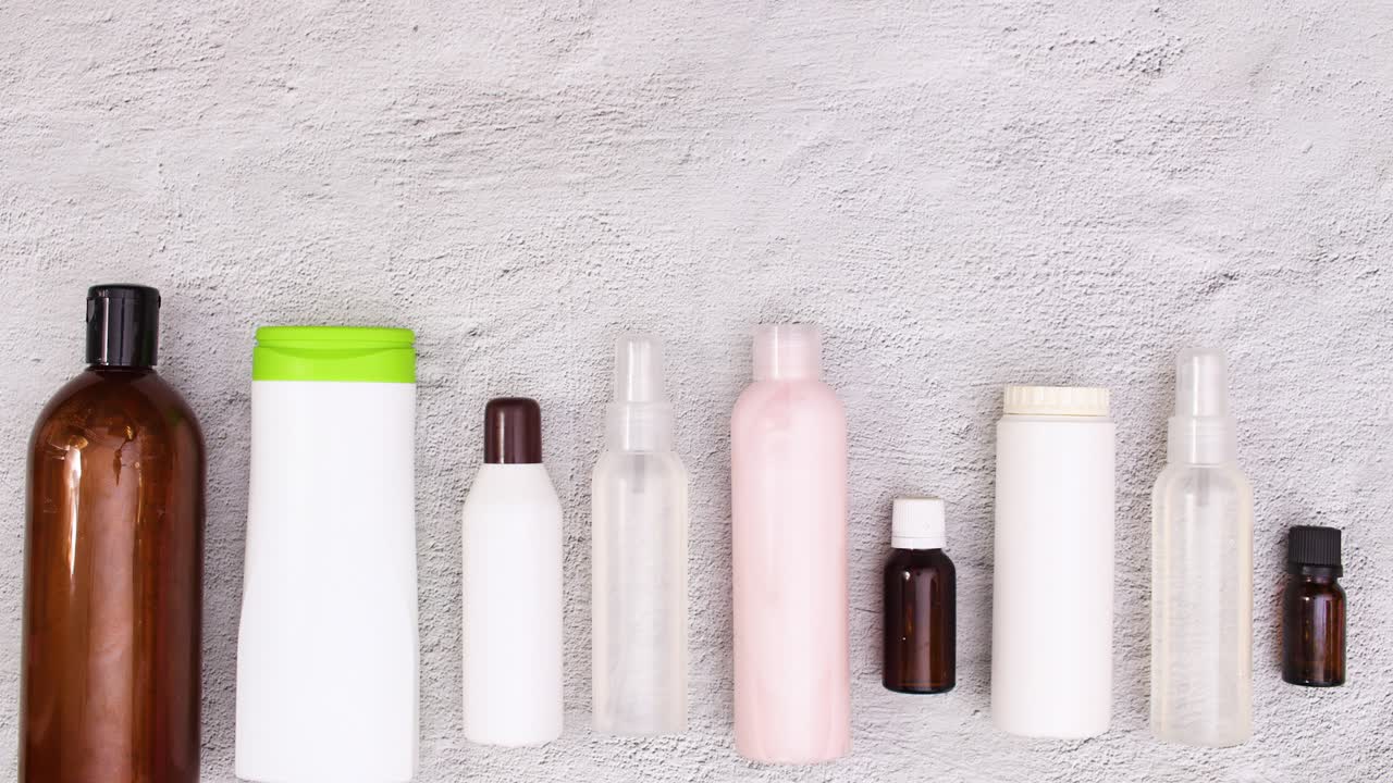Skin care cosmetics products move up and down on the table. Stop motion