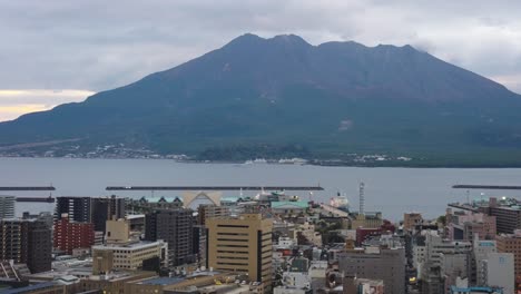 sakurajima volcanic and kagoshima city skyline in evening, southern japan