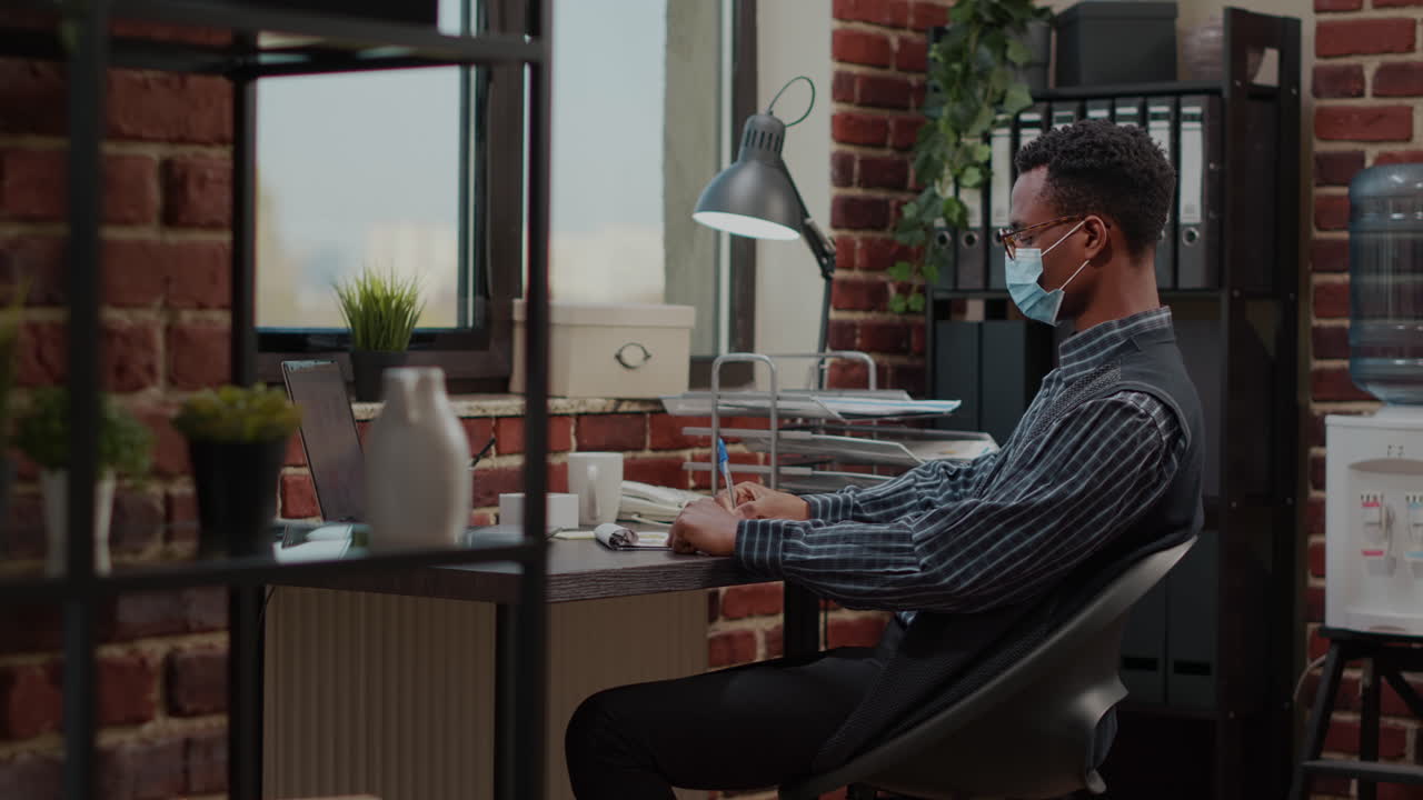 African american man relaxing on break after finishing commercial work