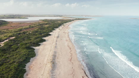 Idyllic-Seascape-At-Riserva-naturale-orientata-Oasi-Faunistica-di-Vendicari-Nature-Preserve-In-Italy---drone-shot