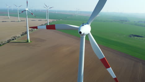 aerial view of wind turbines in a farmland