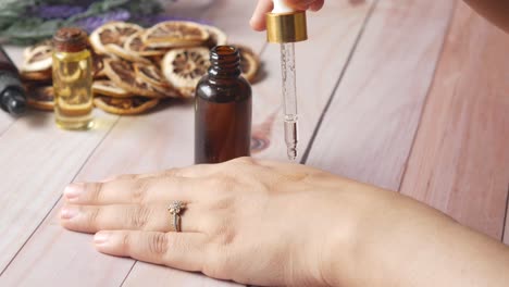 applying essential oil to hand