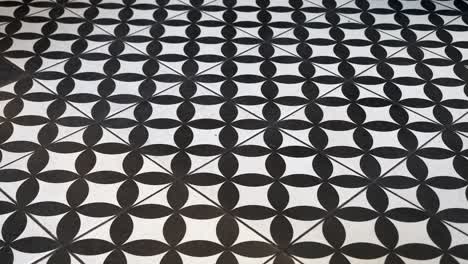 black and white geometric floral tile floor