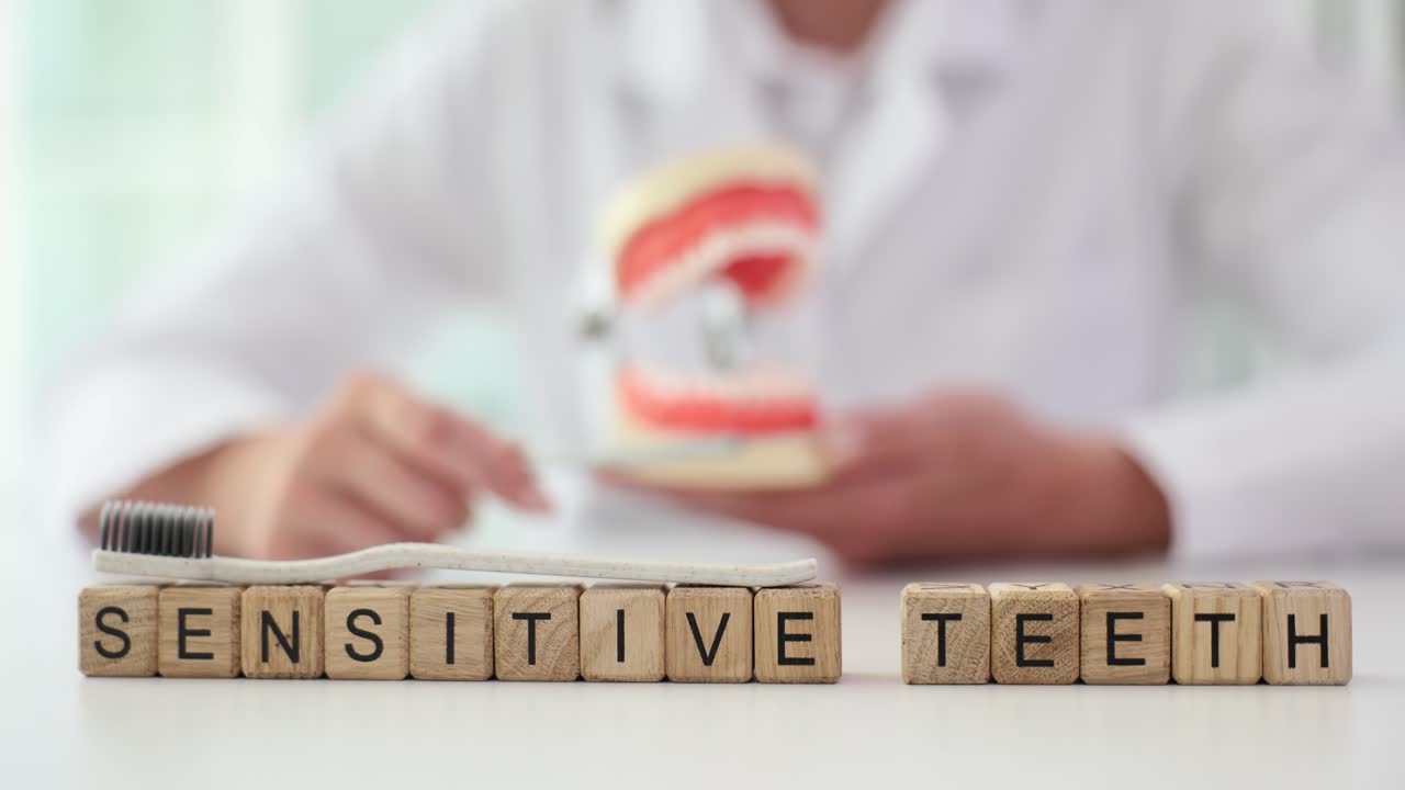 Understanding Sensitive Teeth with Dental Professional and Model