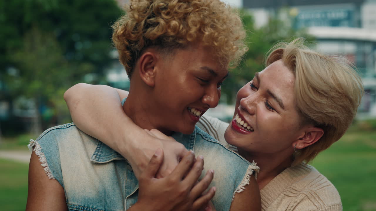 Affectionate LGBTQ couple sharing a loving moment in the park