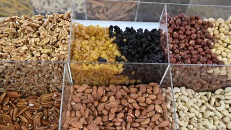 dry fruit and nuts are displayed during the gulf food exhibition, united arab emirates