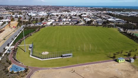 Aerial-View-Over-Football-Field-With-Baseball-Pitch,-Butler-Perth-Australia