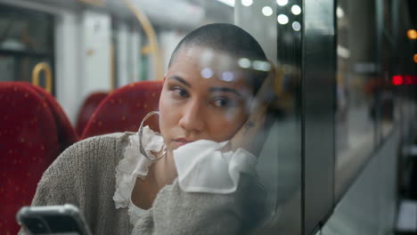 young woman on a train at night