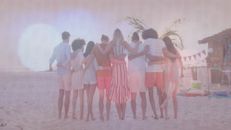 on beach, group of friends embracing near palm tree and hut, enjoying animation