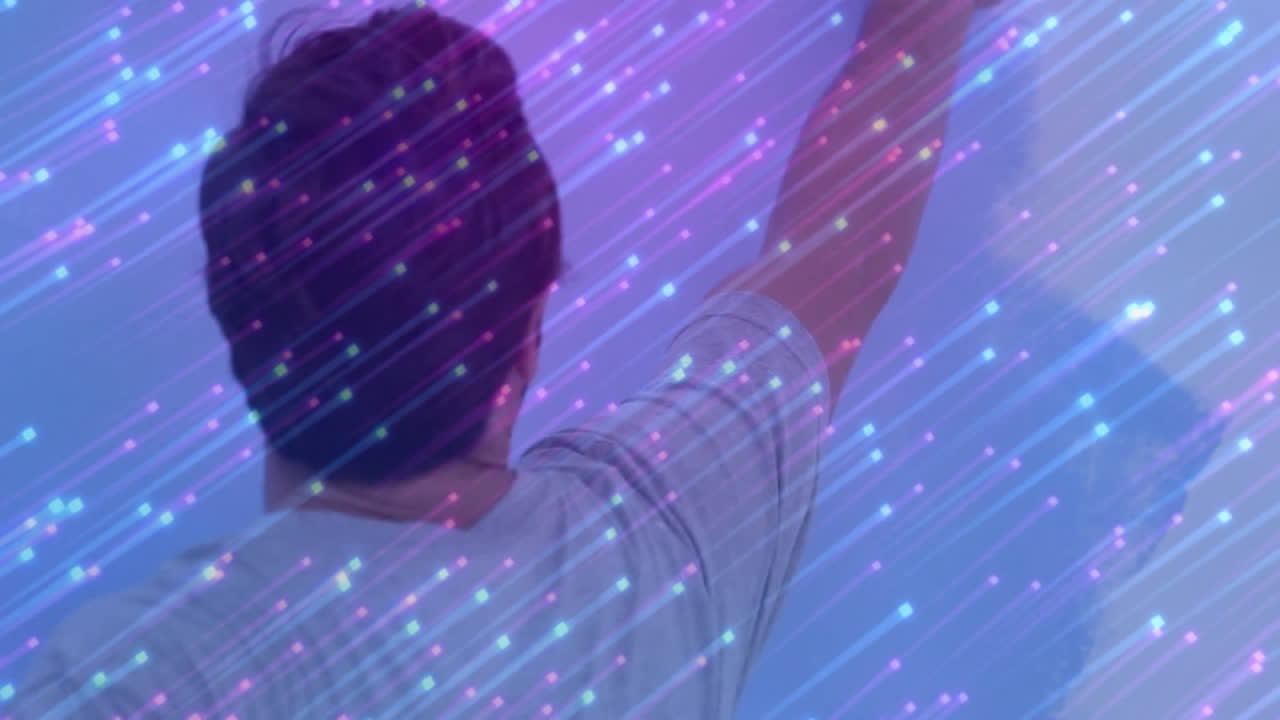 Reaching towards colorful animation, person interacting with digital light streaks