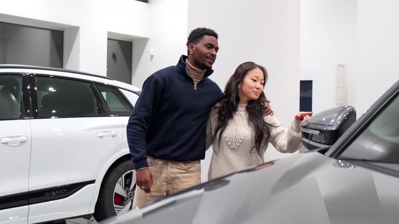 Couple Looking at Cars