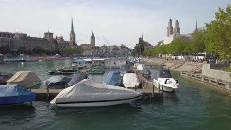 zurich, switzerland - october 25, 2017: boats on lake zurich, buildings of the city in the background