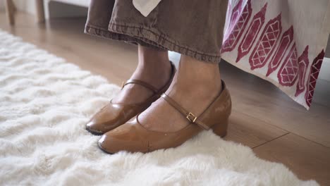 close up of mary jane shoes on a carpet